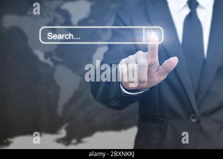 Businessman clicking internet search page on virtual screen. Concept of searching with pressing button. Elements of this image furnished by NASA Stock Photo