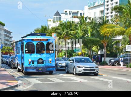 MIAMI BEACH, USA - MARCH 31, 2017 : Blue trolley on the bus stop in Miami Beach. Miami BeachTrolley provides free transportation in the city Stock Photo