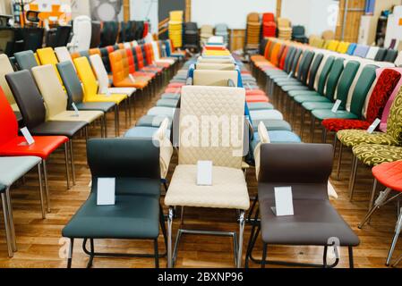 Rows of chairs in furniture store showroom Stock Photo