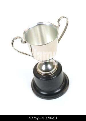 An old tarnished trophy isolated against a white background Stock Photo