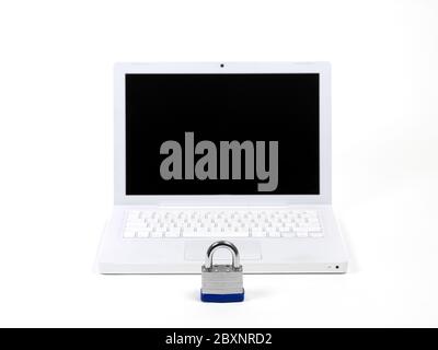 A laptop computer and a padlock isolaterd against a white background higlighting computer security Stock Photo