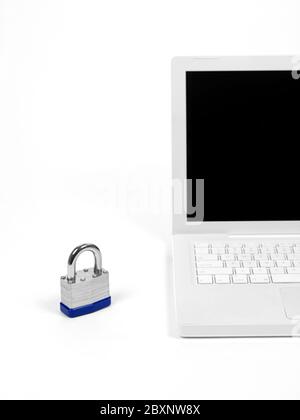 A laptop computer and a padlock isolaterd against a white background higlighting computer security Stock Photo