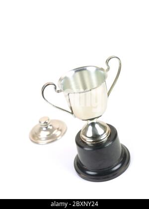 An old tarnished trophy isolated against a white background Stock Photo