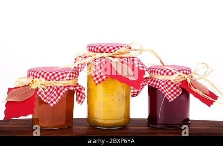 Homemade jam, jelly and pickles with gift tags against white background with space for text Stock Photo