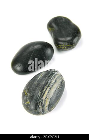 Black river rocks isolated against a white background Stock Photo