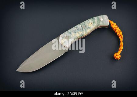 Fixed blade knife isolated on black background. Stock Photo