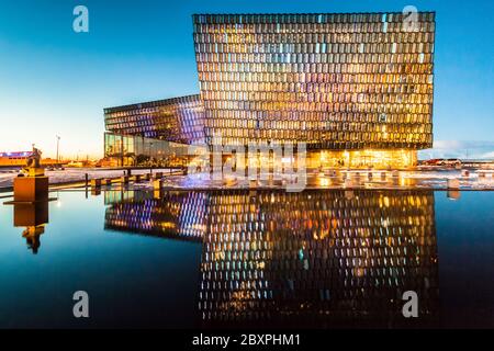 Harpa Concert Hall view during blue hour which is a concert hall and conference centre in Reykjavik, Iceland Stock Photo