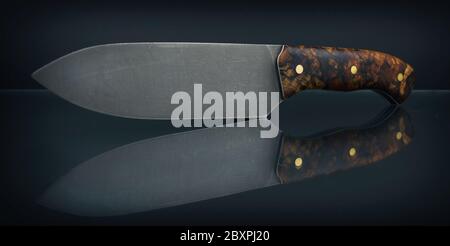 Fixed blade knife isolated on black background. Stock Photo