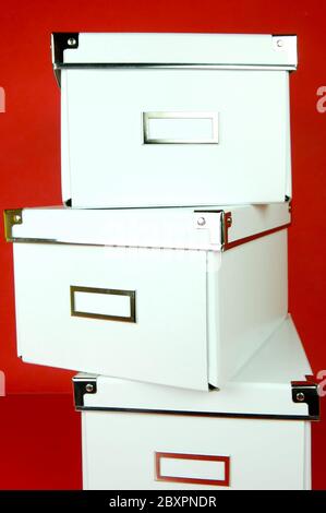 Isolate Storage Boxes Storage boxes isolated against a red background Stock Photo - Alamy