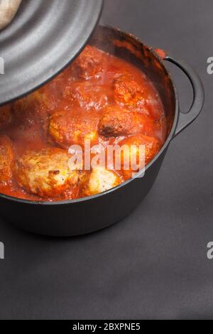A dish from Libya called Mafrum of potatoes stuffed with minced beef and cooked in a tomato sauce Stock Photo