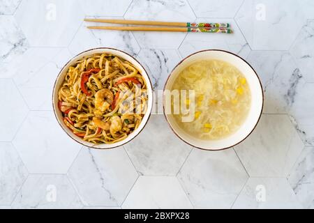 Pad Thai Noodles and Corn Soup with Chicken Slices Healthy Asian  Traditional Food. Stock Photo