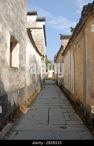 Xidi Ancient Town in Anhui Province, China. A backstreet in the old town of Xidi with historical buildings and flagstone path Stock Photo