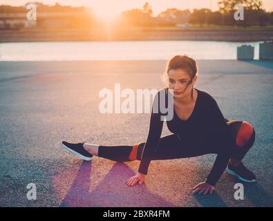 Beautiful fat woman doing yoga on the mat in the park Stock Photo - Alamy