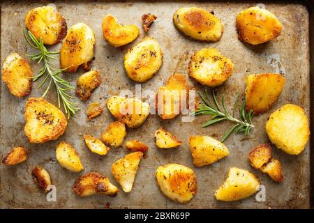 close up of rustic golden english roasted duck fat potatoes Stock Photo