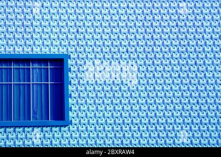 Royal blue window on light blue modern style facade Stock Photo