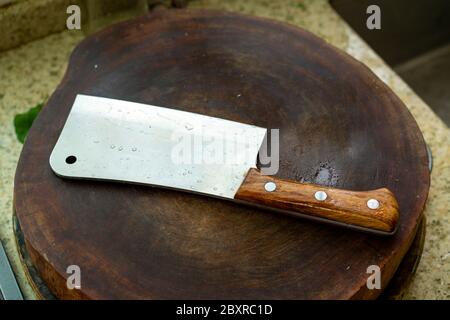A kitchen knife on a cutting board in the kitchen Stock Photo