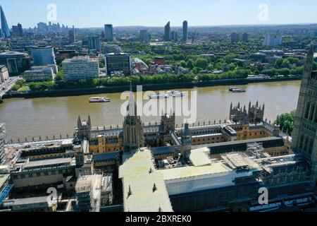 An aerial view of central London showing the the House of Lords and the Victoria Tower at the Palace of Westminster, Old Palace Yard and Abingdon Street, Abingdon Street Gardens and Jewel Tower, Great College Street at the junction with Millbank with Victoria Tower Gardens running alongside it leading up to Lambeth Bridge, and the River Thames, and on the south side (top): St Thomas' Hospital, and the Evelina London Children's Hospital, Archbishop's Park and Lambeth Palace. Stock Photo
