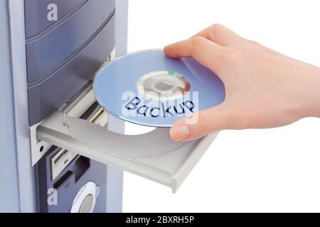 Hand and computer disk backup Stock Photo