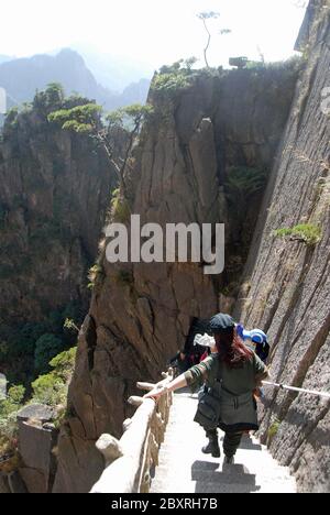 Huangshan Mountain in Anhui Province, China. Walking down a steep path in the West Sea or Xi Hai canyon on Huangshan. Stock Photo