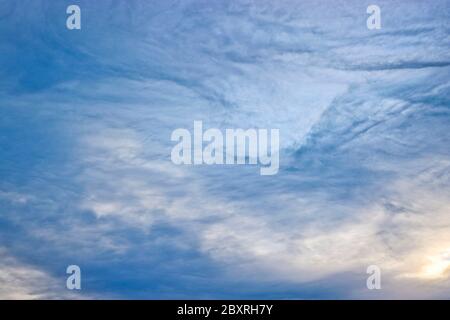 Evening sky with cirrus clouds. Natural background. The texture of the clouds. Stock Photo