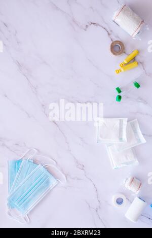 Flat lay of some medical supplies against a white marble background with plenty of copy space Stock Photo
