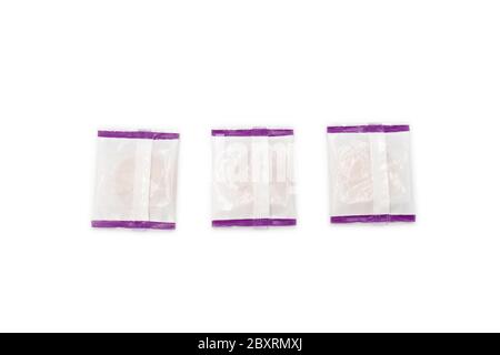 Square plastic packs the cooking in side, which shoot from the backside of package in isolate white background. Stock Photo