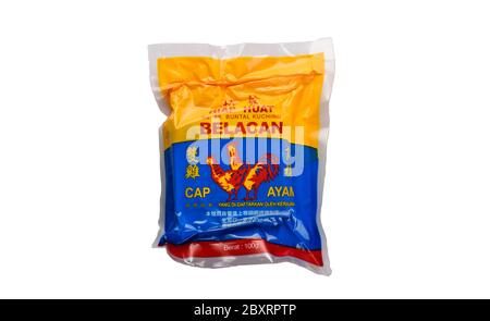 Kuching, Sarawak / Malaysia - May 10, 2020: belacan shrimp paste of cap ayam brand in a packet of white background Stock Photo