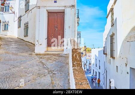 ARCOS, SPAIN - SEPTEMBER 23, 2019: Walk the old curved streets of pueblo blanco (white town) and explore historic buildings, small yards and scenic si Stock Photo