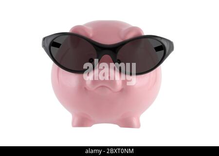 Saving for a sunny day. Pink piggy bank wearing sunglasses isolated on white with clipping path Stock Photo