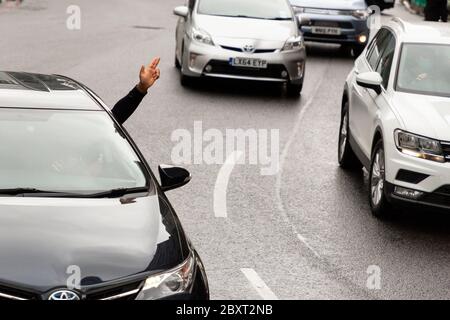 A driver signals in support out their window during the Black Lives Matters protest in Victoria, London, 6 June 2020 Stock Photo