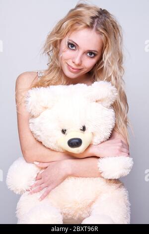 Beautiful Girl With A Teddy Bear Stock Photo