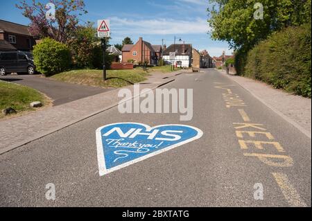 Thank you NHS in blue painted outside Cobham school closed due to pandemic and social distancing due to coronavirus.