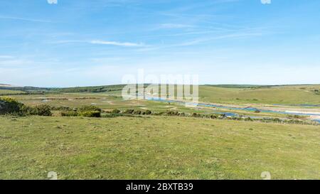 Cuckmere Haven, East Sussex, England. An elevated view of the meandering river, countryside and flood plains on the English South Downs. Stock Photo