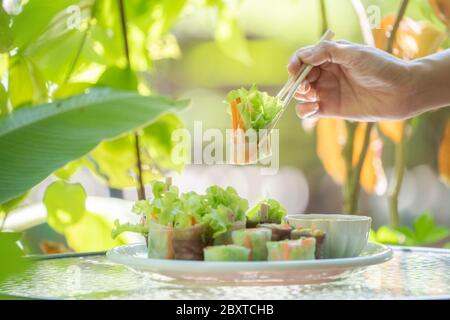 Thai fresh spring roll or  Fresh Vegetable Rice Wraps is the vegetable inside the roll. Eat with specific sauce beside it. Stock Photo