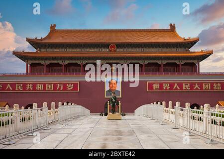 Beijing / China - Tiananmen Square - main entrance to Forbidden City. A Chinese soldier stands at attention with a portrait of Mao Zedon Stock Photo