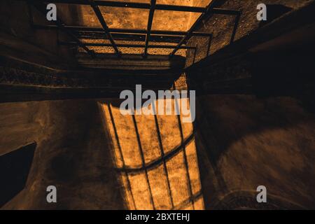 shadows from the lattice in a mysterious corridor in the old room in the castle Stock Photo