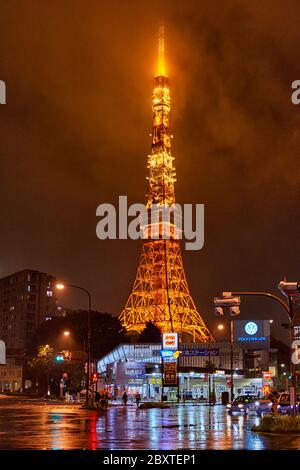 Tokyo / Japan - October 19, 2017: Illuminated Tokyo Tower reflecting in the wet streets of Tokyo during a rainy night Stock Photo