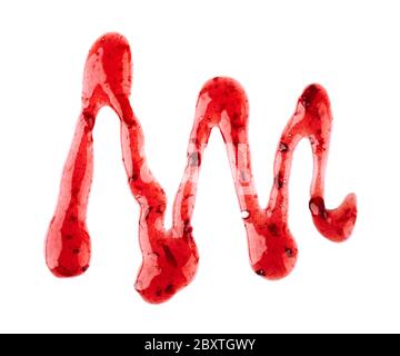 Cherry jam drizzle isolated on white background. Splashes of red berry jam. Top view. Stock Photo