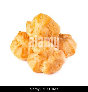 Homemade profiteroles with cream,isolated on a white background. Fresh baked golden profiterole. Custard cake. Stock Photo
