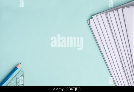 Stack Folding drawings on a blue background. Top view. Flat lay. Copy space Stock Photo