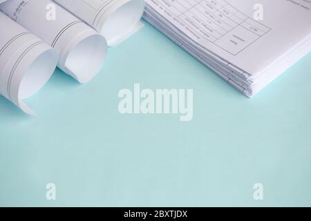 Stack Folding drawings on a blue background. Top view. Flat lay. Copy space Stock Photo