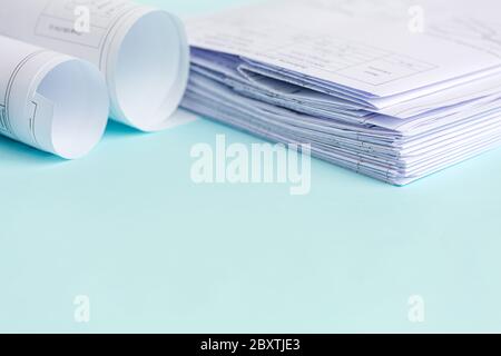 Stack Folding drawings on a blue background. Top view. Flat lay. Copy space Stock Photo