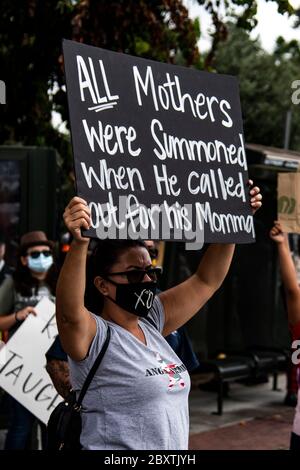 Protester with sign at demonstration honoring George Floyd, in the Highland Park neighborhood of Los Angeles, California Stock Photo