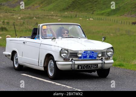 MOFFAT, SCOTLAND - JUNE 29, 2019: 1969 Triumph Herald 13/60 car in a classic car rally en route towards the town of Moffat, Dumfries and Galloway Stock Photo