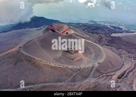 Tourists on the Etna volcano in Sicily seen from above- view of the Barbagallo crater of the volcano Stock Photo