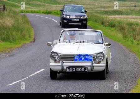 MOFFAT, SCOTLAND - JUNE 29, 2019: 1970 Triumph Herald 13/60 car in a classic car rally en route towards the town of Moffat, Dumfries and Galloway Stock Photo