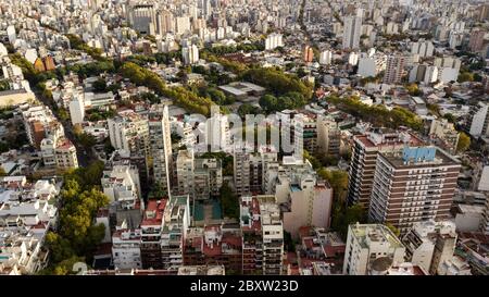 Aerial view of the Palermo district in Buenos Aires during the sunset with the view on buildings, parks, autumn trees, apartments, and rooftops. Stock Photo