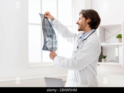 Young medical doctor checking good x-ray scans Stock Photo