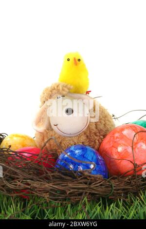 Easter basket with eggs, sheep and chicks Stock Photo