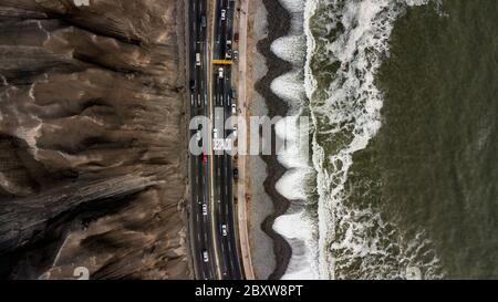 Aerial photo of the highway next to the Pacific Ocean in Lima, Peru, next to the cliffs Stock Photo
